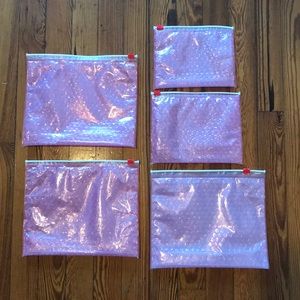 Glossier pink pouches (various sizes)